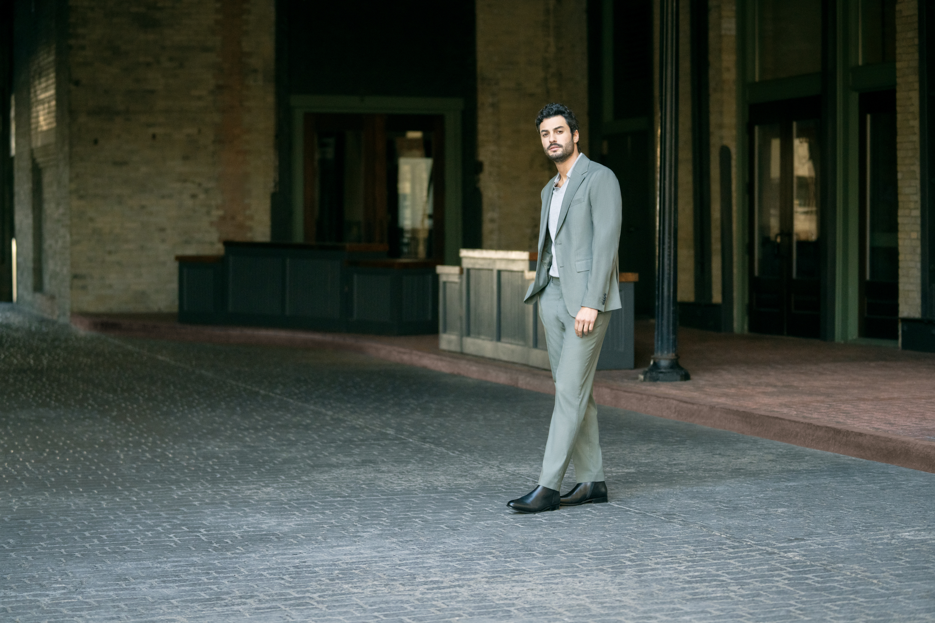 Must Have Boots for 2025 Image Featuring a man in a suit wearing Centurion Boots in Black.